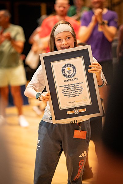 Bly holding her framed GWR certificate