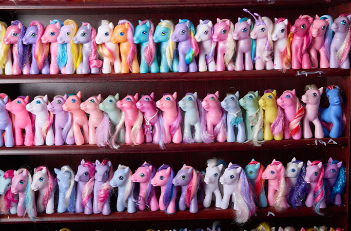 ponies lined up on shelves