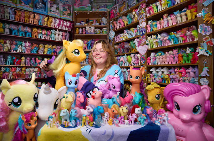 Miranda looking at stuffed pony