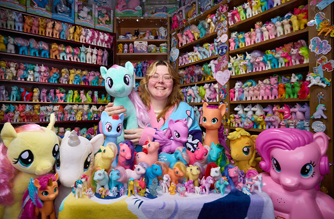 Miranda with full collection looking at camera