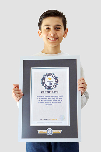 Noah holding his framed GWR certificate