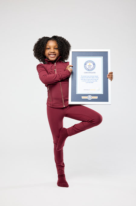 phoenix doing tree pose with certificate