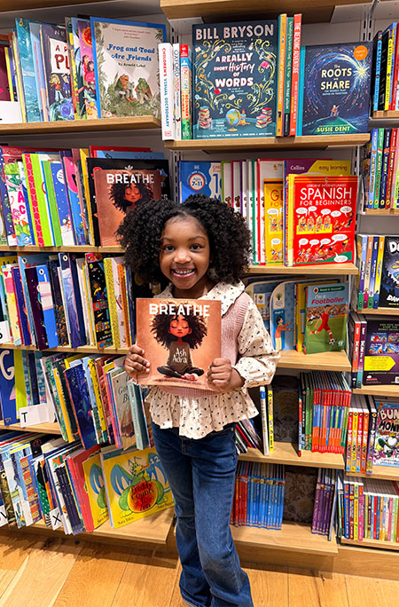 phoenix in library holding book