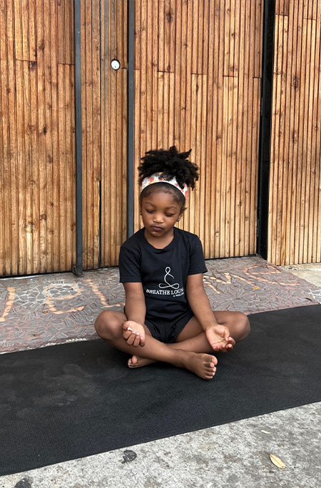 phoenix practicing yoga eyes closed