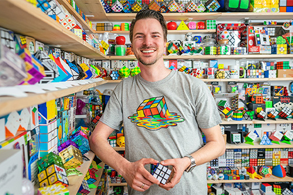 Man with his Rubiks cube collection