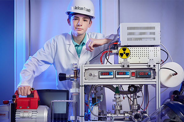 Jackson oswalt in lab coat and helmet