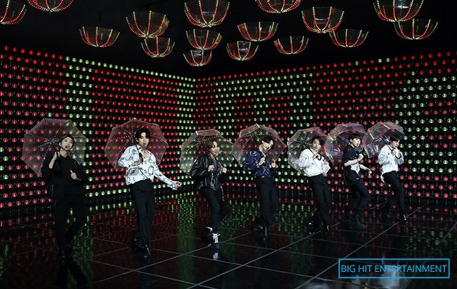 bts holding umbrellas while performing