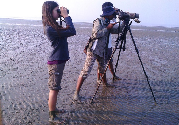 mya looking through binoculars 