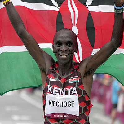 Eliud Kipchoge holding Kenya flag