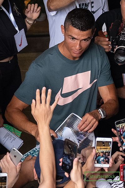 ronaldo taking pictures and signing autographs