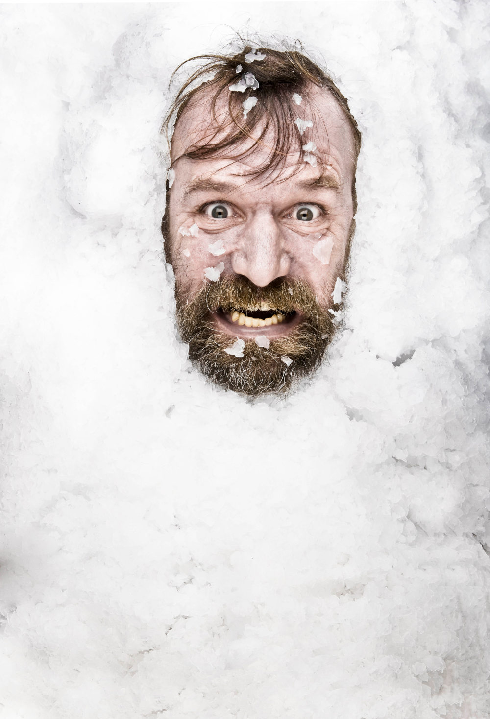 wim hof covered in snow