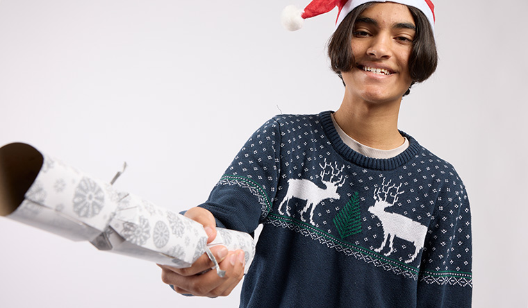 boy with christmas crackers