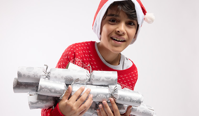 boy with christmas crackers