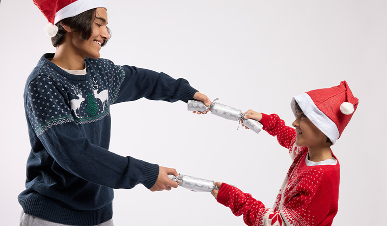 boys playing with santa hats