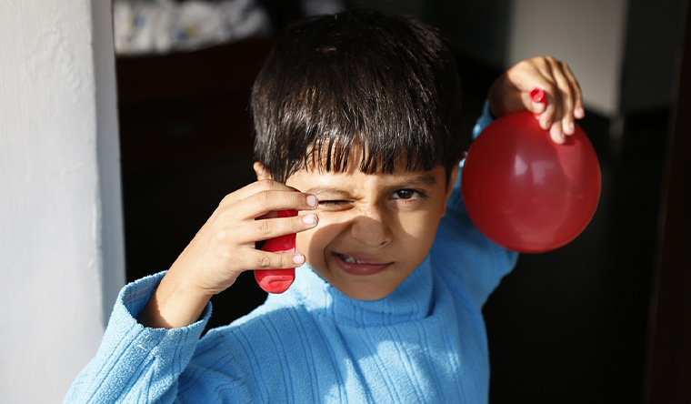 Boy with water balloons