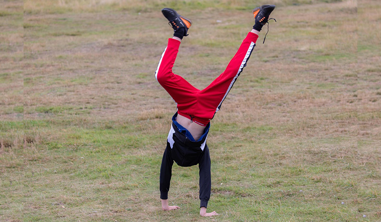 boy cartwheeling