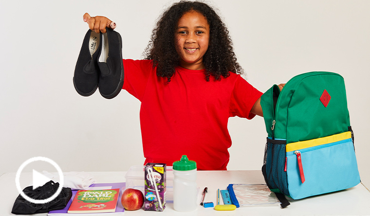 Girl packing a school bag