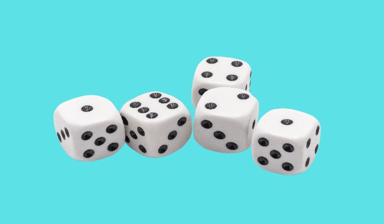 five dice on a blue background