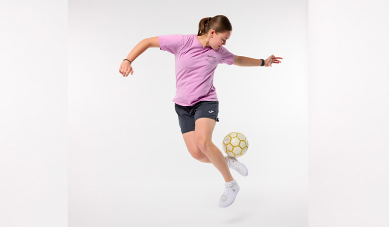 Isabel doing football trick