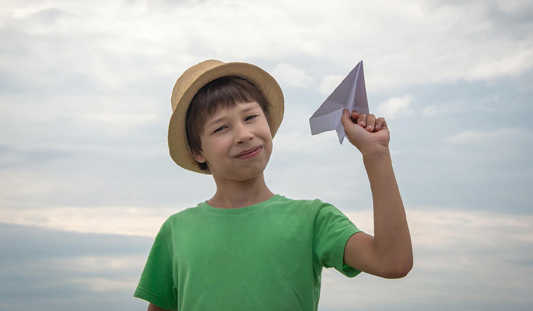 boy with paper plane