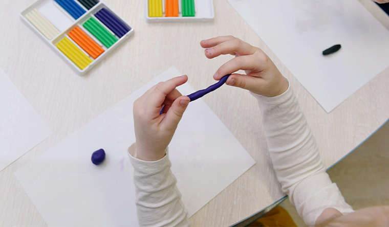 Kid's hands with playdough