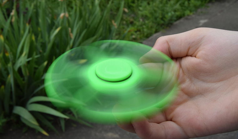 Hand spinning a spinning top