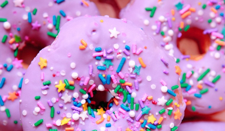 Doughnuts with pink icing and sprinkles