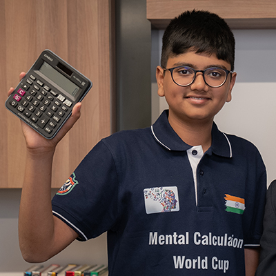 Aaryan Shukla holding a calculator