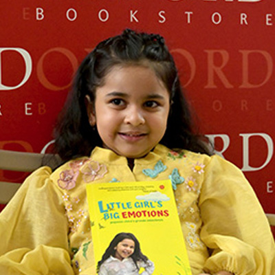 anvi holding book