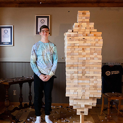 Auldin next to Jenga tower