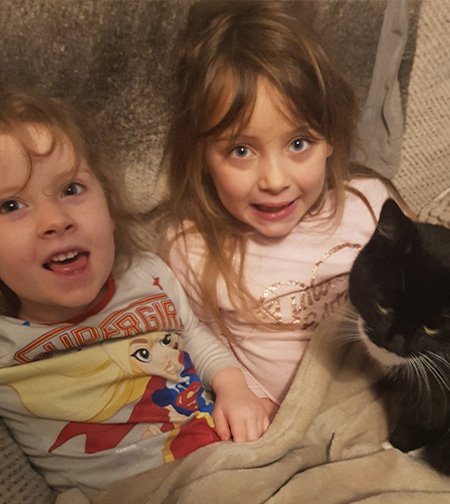 Bella with her sister and cat