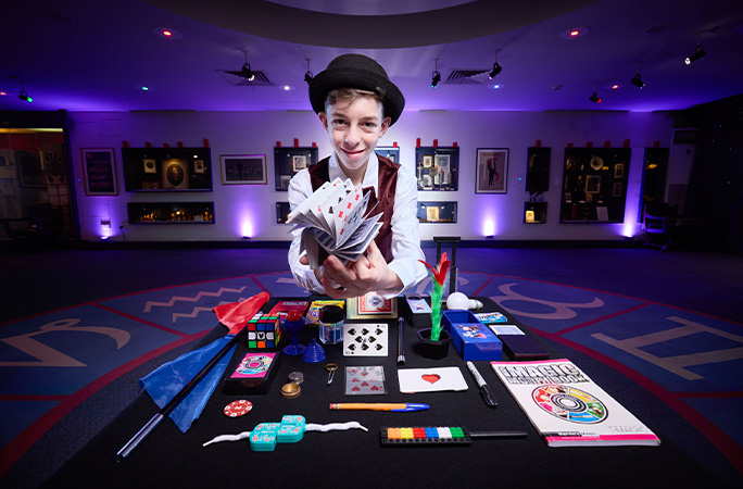 Cillian smiling with cards