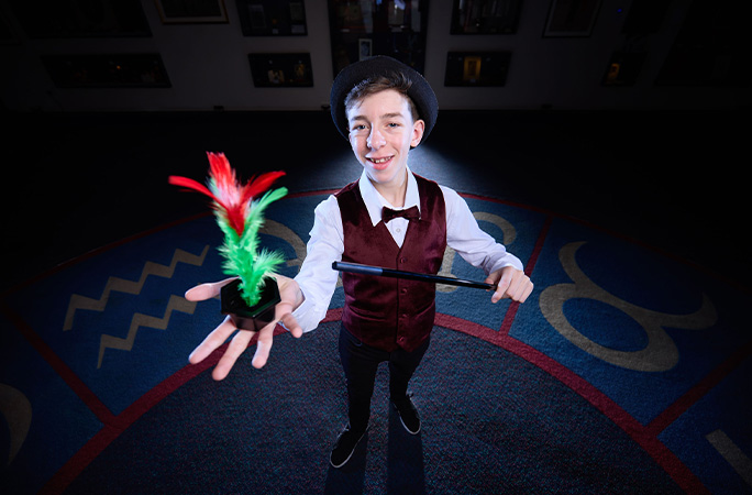 Cillian with feather and wand
