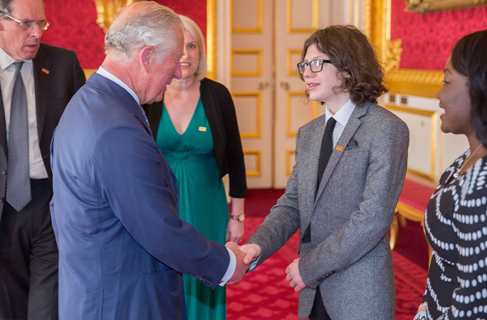 Dara shaking hands with King Charles