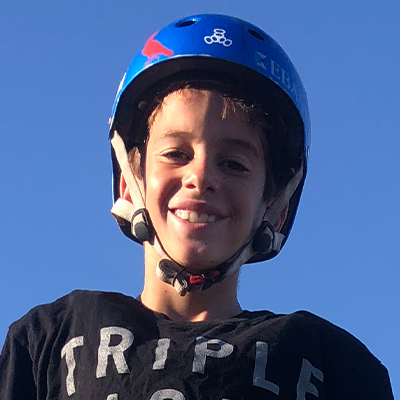 Gui Khury smiling while wearing blue helmet