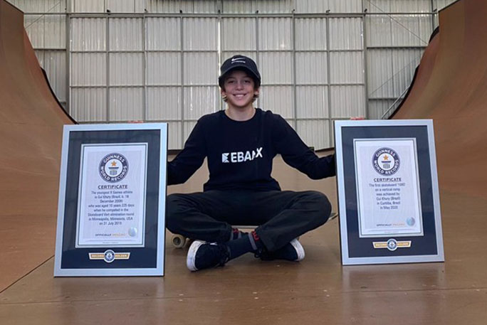 Gui posing with two of his gwr certificates