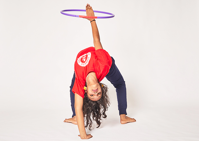 Janani doing bridge with hula hoop