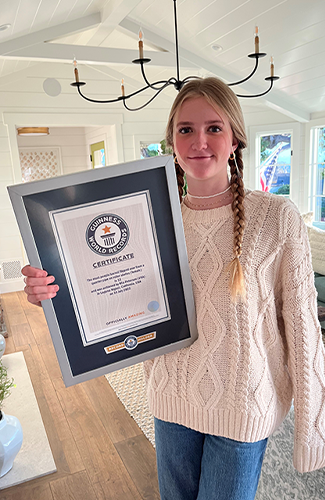 Mia holding record cetificate