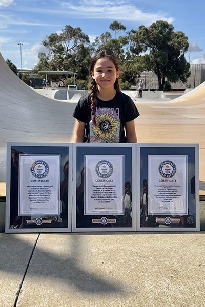 Mia Kretzer sat with her three framed GWR certificates at the skate park