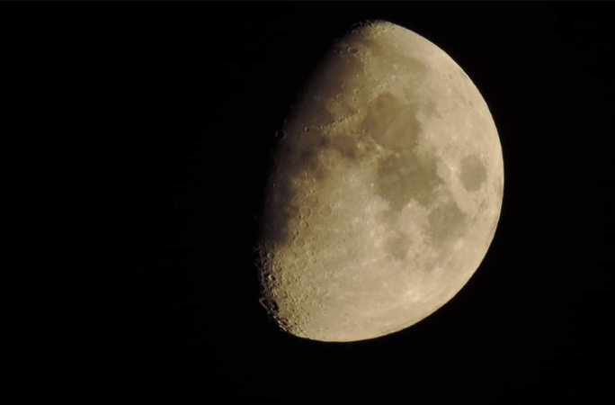 Moon in black night sky