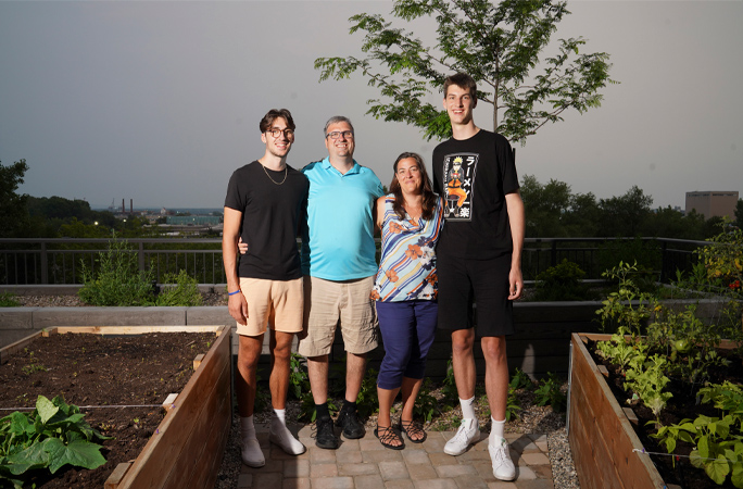olivier standing next to his family