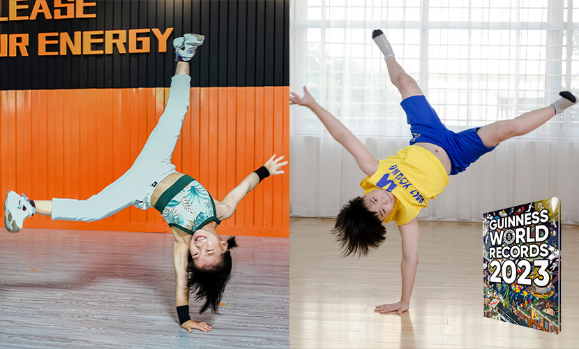 qi and wang doing one hand handstands