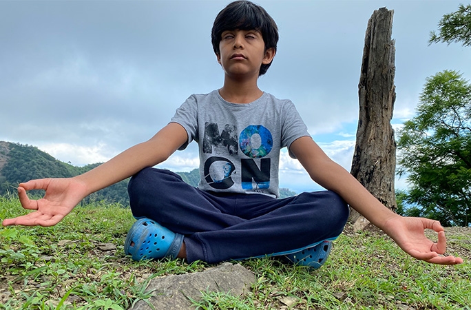 Reyansh Surani meditating in park