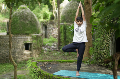 Reyansh practicing yoga in nature