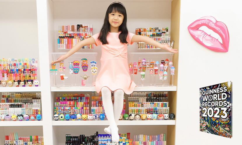 scarlett with her collection of lip balms