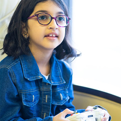 Simar holding video game controller
