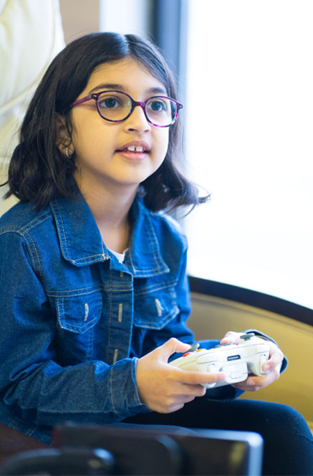 Simar Khurana with videogame controller