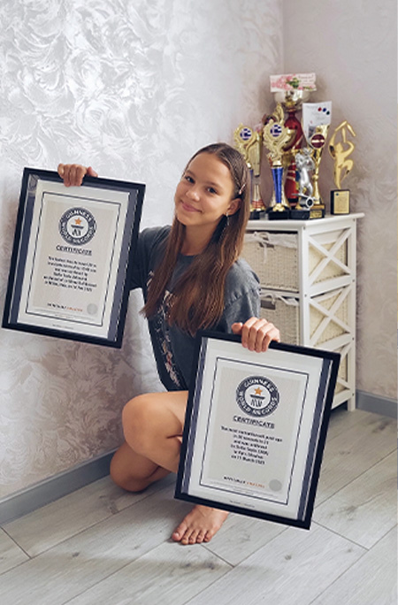 Sofia Tepla holding 2 certificates