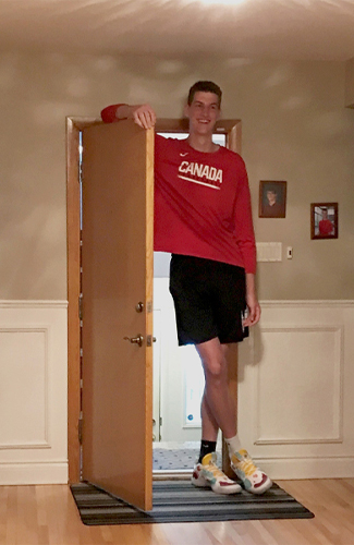 olivier standing next to doorway in his home