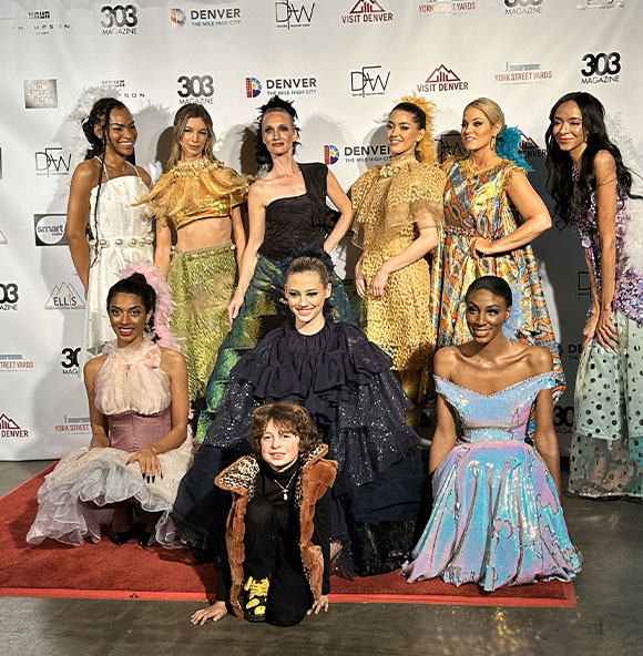 Max posing with models